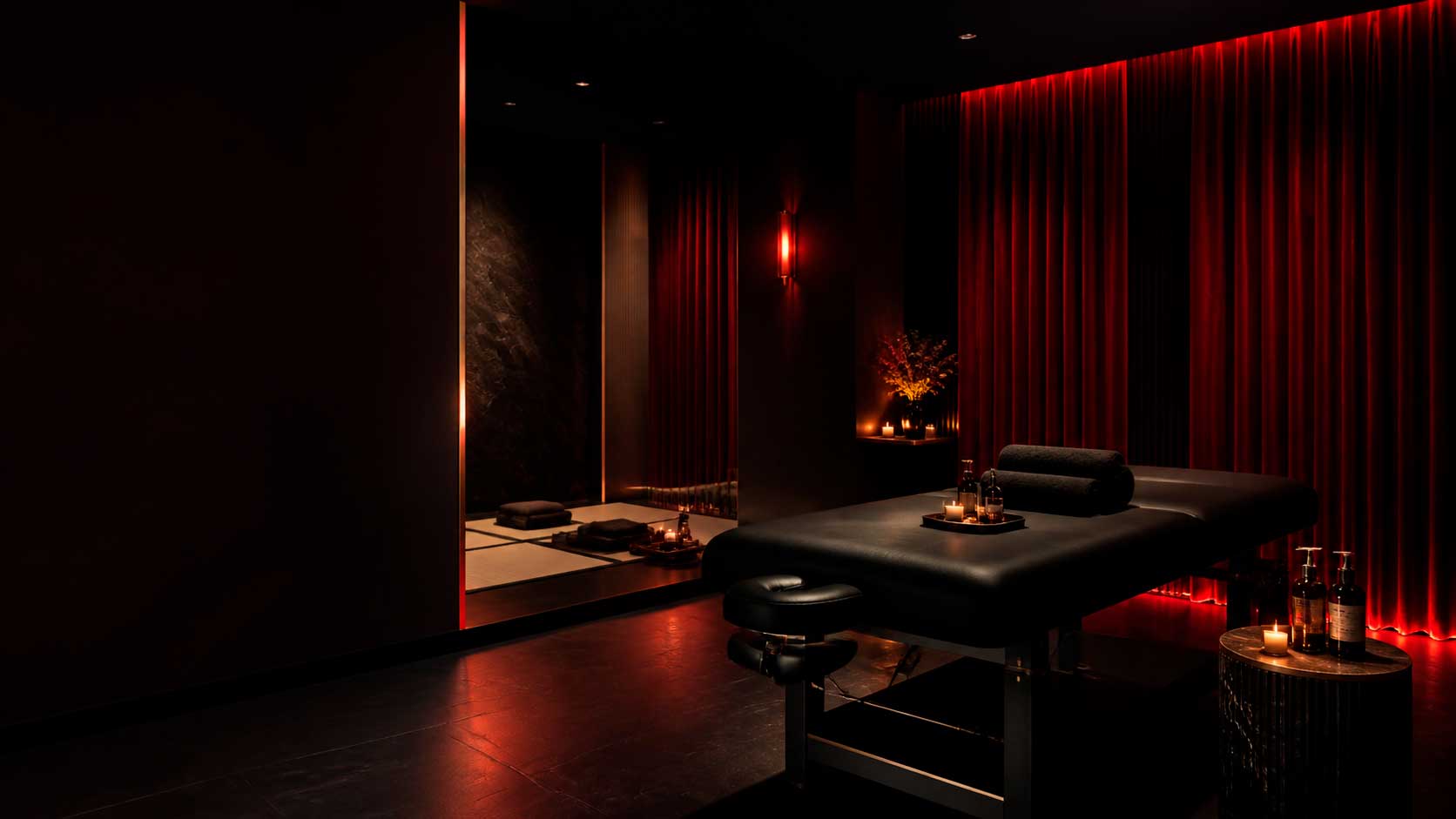 Sala privada Red Velvet con camilla, tatami, luz roja y ambiente premium